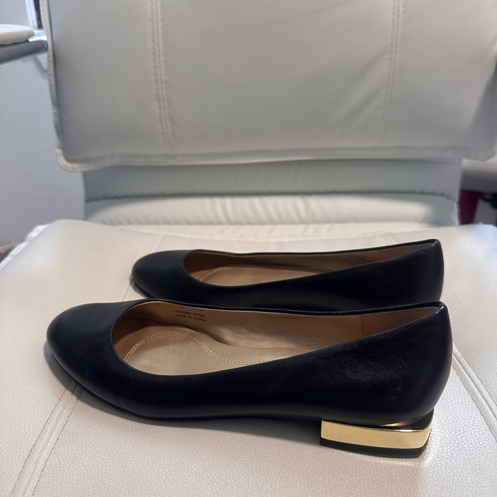 Tahari Black and Gold Flats with Sleek Design